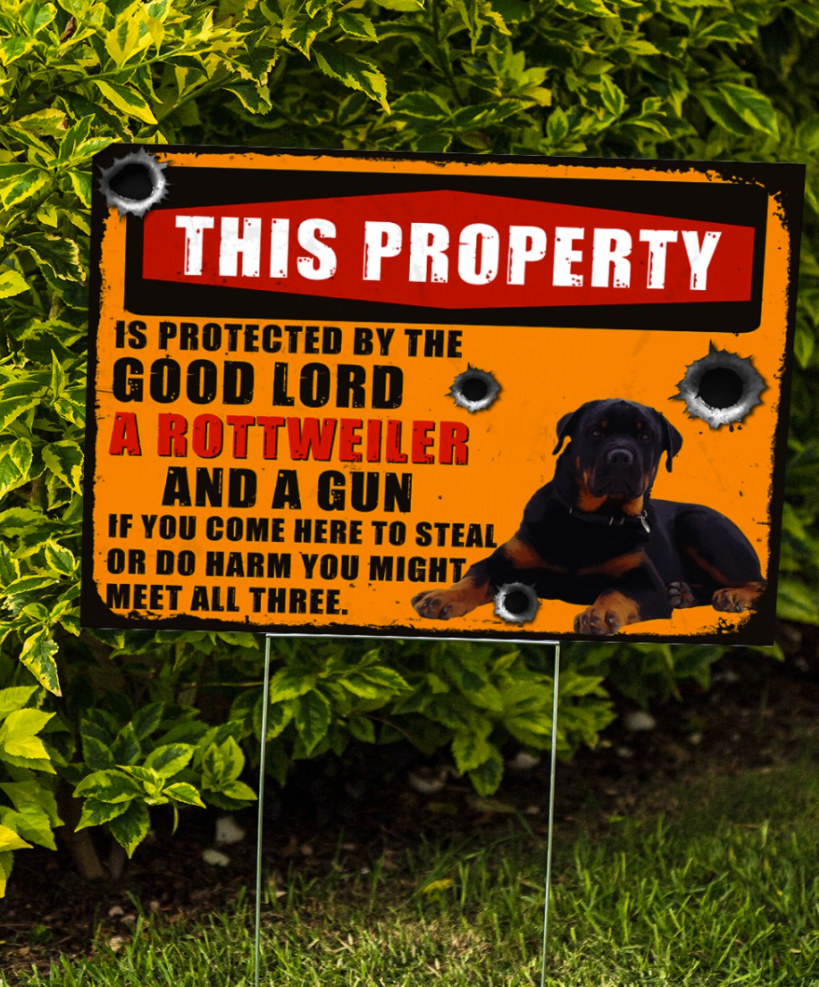 This property is protected by the good lord a rottweiler and a gun yard sign 1