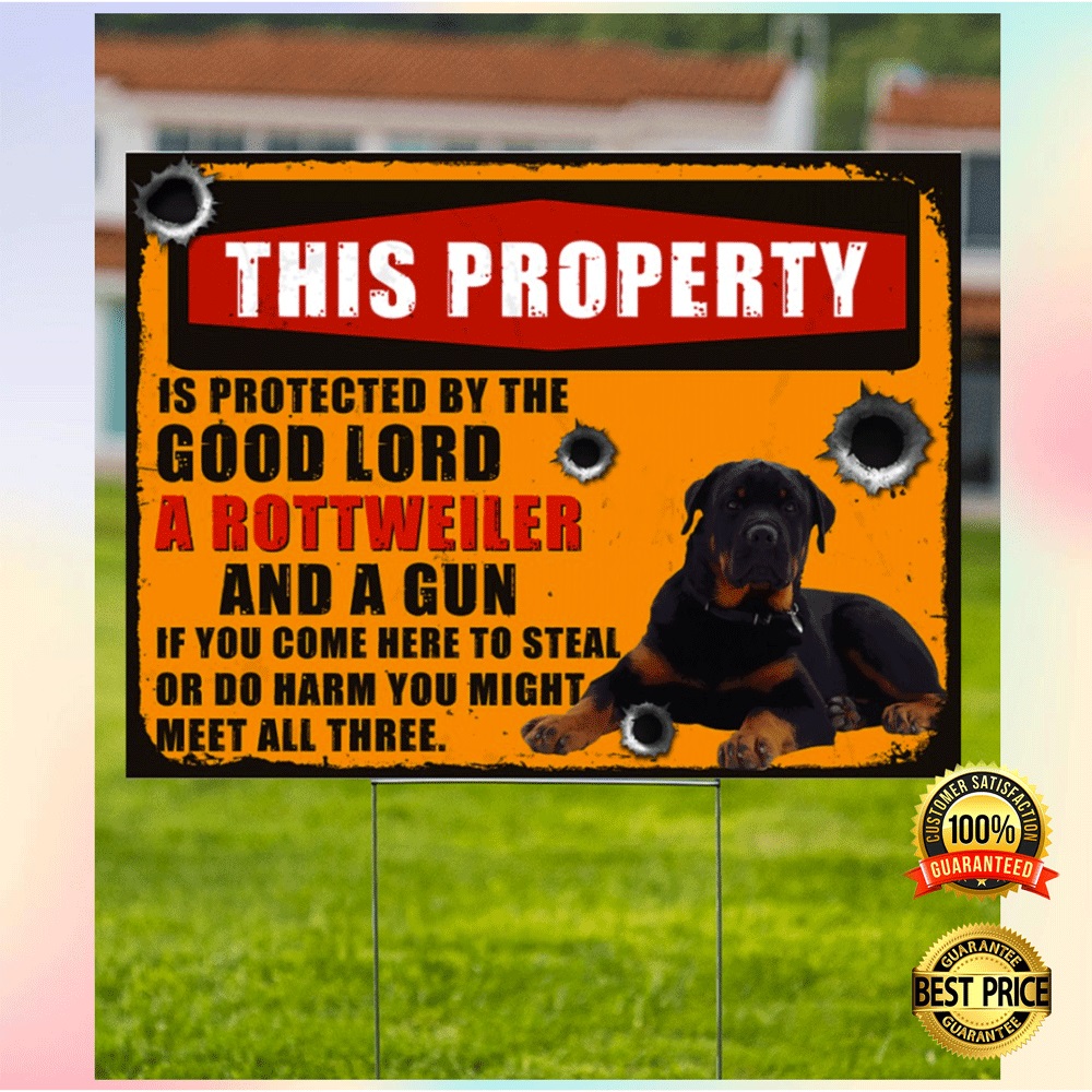 This property is protected by the good lord a rottweiler and a gun yard sign1